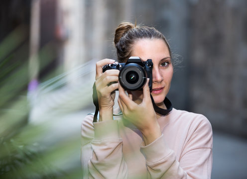 Portait of woman which is taking photos