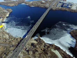 Moscow Bridge across Dnepr River, photo from drone at winter. Kiev,Ukraine