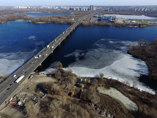 Moscow Bridge across Dnepr River, photo from drone at winter. Kiev,Ukraine