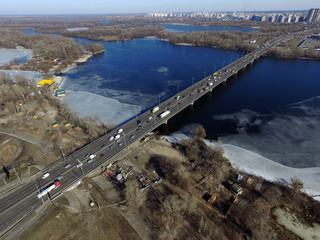 Moscow Bridge across Dnepr River, photo from drone at winter. Kiev,Ukraine