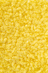 yellow natural pellets beeswax background