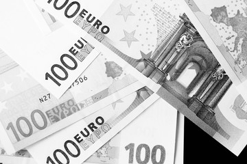 Fototapeta na wymiar One Hundred euro banknotes as a background close up. Black and white