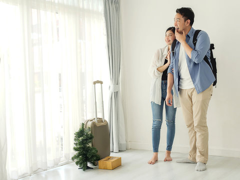 Happy young couple in love move to new home, lifestyle concept.