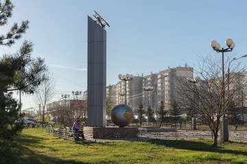 Monument to the legendary polar pilot, Major General Vasily Molokov with an R-5 airplane model on a stele in the Krasnoyarsk public garden.