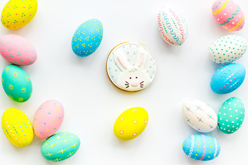 Easter symbols. Colorful Easter eggs and gingerbread on white background
