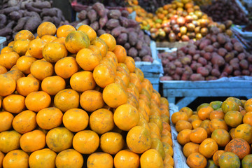 Fresh orange for sale and fresh fruits and vegetables in market