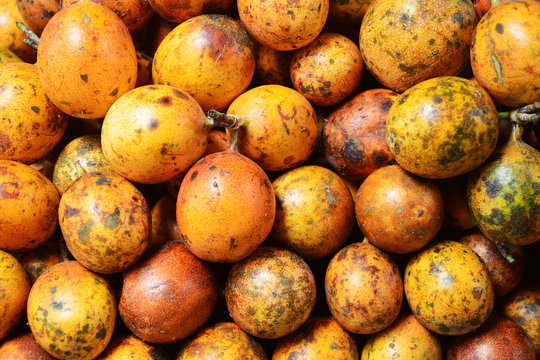 Group of ripe passion fruits in a local market in Brastagi, Indonesia.
