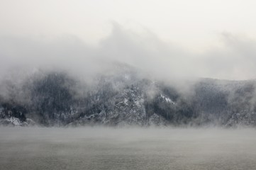 Obraz na płótnie Canvas Foggy morning on the Yenisei river in winter near Krasnoyarsk in Siberia, Russia