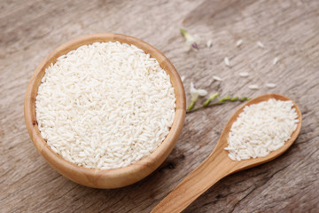 raw paddy rice in wooden bowl 