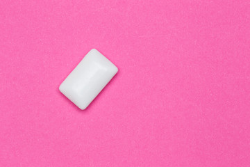 Chewing gum close up on a pink background