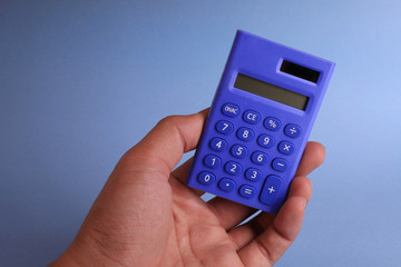 Hand holding calculator