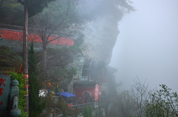 Ancient kungfu Temple on a wall of mountain