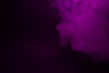 Colorful smoke close-up on a black background