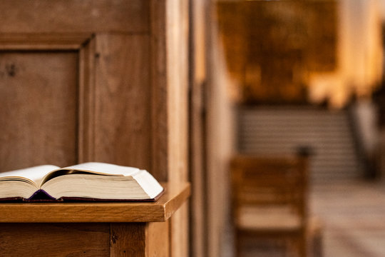 Holy book in front on a desk  inside  the church, closeup