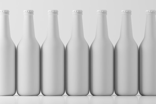 Lots of glass white frosted beverage bottles standing in a row on a light background with reflection. Mock up. 3d rendering