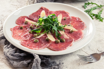 Beef carpaccio with arugula and parmesan
