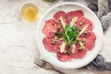 Beef carpaccio with arugula and parmesan