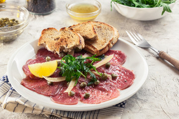 Beef carpaccio with arugula and parmesan
