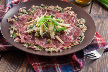 Beef carpaccio with arugula and parmesan