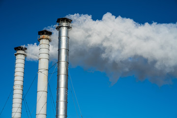 Pollution and smoke from chimneys of factory or power plant