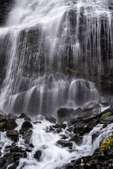 Fototapeta na wymiar A beautiful landscape with mountain waterfall in Terskol. Elbrus area, Kabardino-Balkaria, Russian Federation