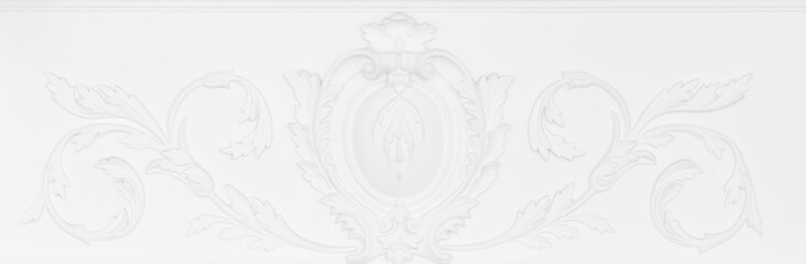 Beautiful ornate white decorative plaster moldings in studio