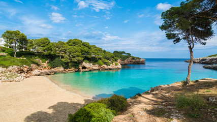 Cala Dor bay at Cala d'Or city, Palma Mallorca Island, Spain - Powered by Adobe