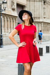 beautiful girl walks through the old European streets