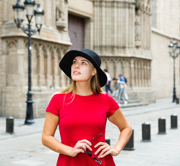 beautiful girl walks through the old European streets