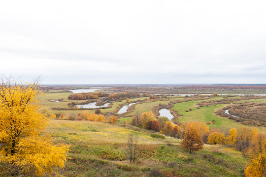 Russian landscape in autumn. View of the plain with the river. Rukavishnikov manor in the village of Podviazye, Bogorodsky District.