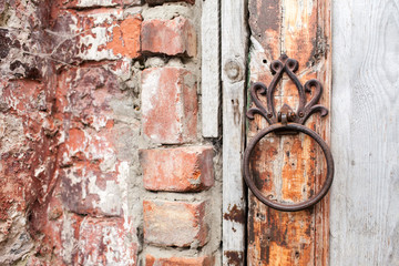 Handle is in the form of a ring on a wooden door. Entrance to the Rukavishnikov manor in the village of Podviazye, Bogorodsky District.
