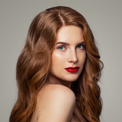 Redhead girl with green eyes and ginger hair studio portrait