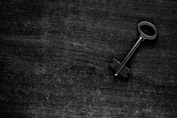 old key on a wooden surface
