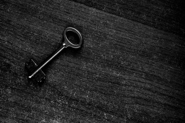 old key on a wooden surface