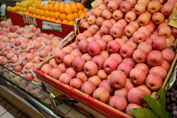 Red apples, oranges and lemons