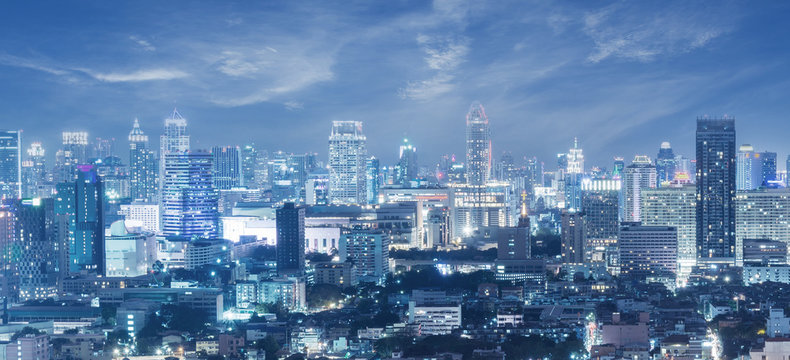 Panorama of Bangkok city skyline during at night blue hour in business district.