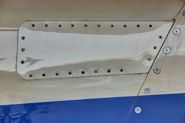 Light jet airplane body panel with plenty of screws