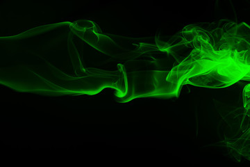 Green smoke on black background and darkness concept