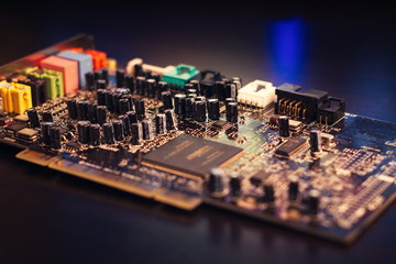 Dusty old sound card close-up. Shot low key, macro and selective focus. (retro lens)