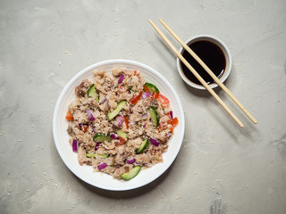 Thai Tuna Salad on the gray table. Top view. 