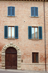 Fototapeta na wymiar old house door and windows detail Rimini Italy
