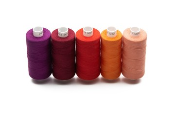 Set of color spool  sewing threads on isolated white background