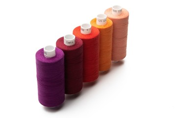 Set of color spool  sewing threads on isolated white background