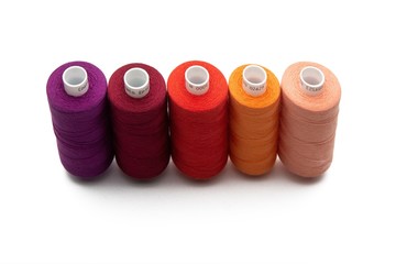 Set of color spool  sewing threads on isolated white background