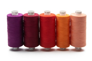 Set of color spool  sewing threads on isolated white background