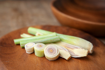 lemongrass slices on wood background.