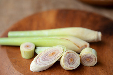 lemongrass slices on wood background.