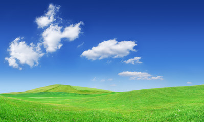 Idyllic view, green hills and blue sky