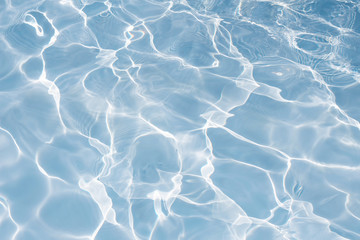 Texture of water in swimming pool for background