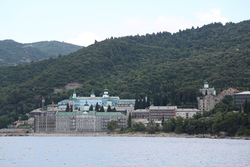 Ship sails along peninsula of Athos, autonomous monastic state in Greece
